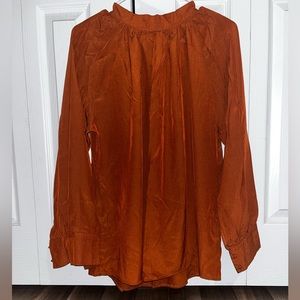Rust brown plus ruched mock neck raglan sleeve blouse.